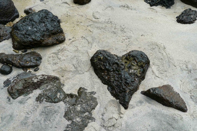 Heart-shaped rock on beach