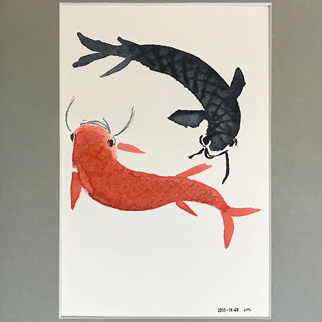 Two carps forming a circle, one is red and the other is dark grey.