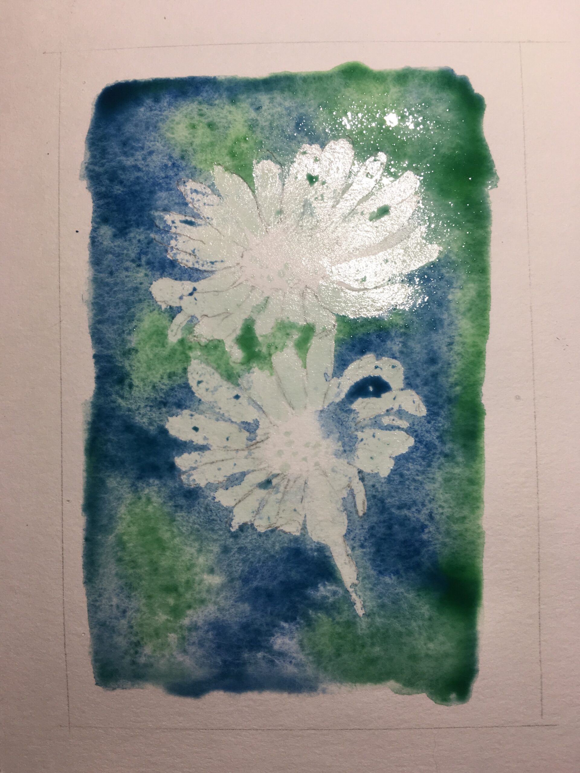 Watercolour wash in blue and green, still wet on paper.