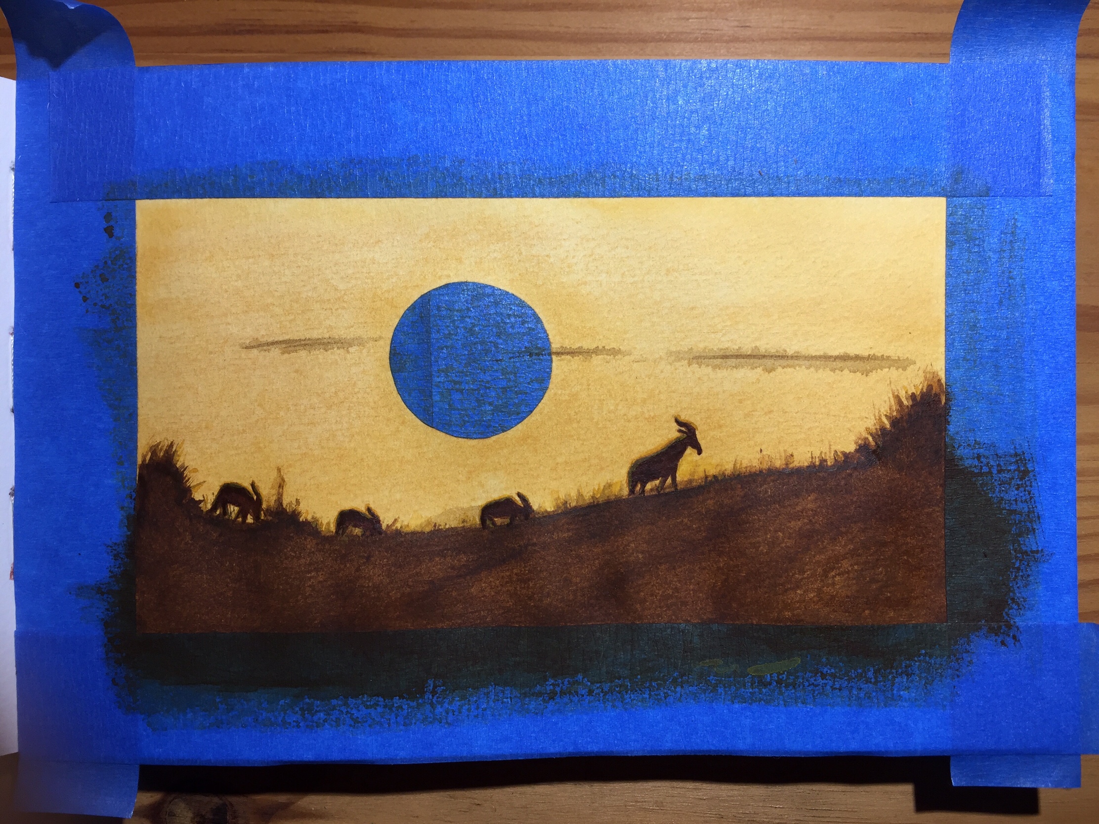 I darkened the ground and painted the antelopes silhouettes with burnt sienna and black