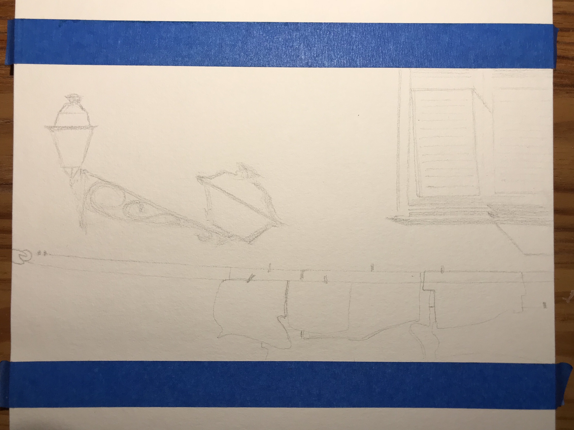 Masking tape and pencil sketch on a large watercolor pad: street lamp and its shadow on the wall it is mounted on, clothesline and clothes, window blinds.