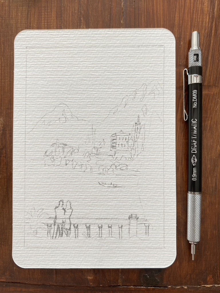 Loose pencil sketch on a textured watercolour postcard. The outline marks an island with a few houses, mountains in the background and a couple of people, plants, balustrade, cypress in the foreground.