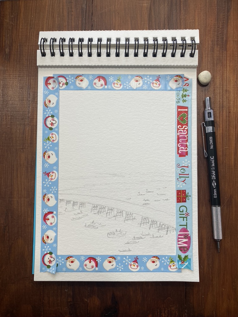 Masking tape on a watercolour sheet with pencil sketch of a large bridge and many boats on the river. My mechanical pencil and tiny rubber are visible on the table.
