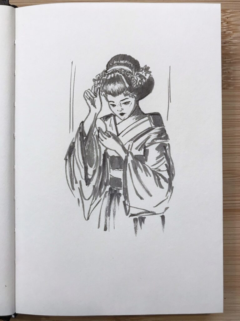 Grey ink drawing of a maiko (apprentice Geisha) checking her reflection in a portable round mirror, and adjusting her hair.
