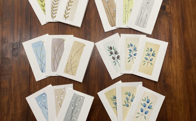 6 series of 3 hand-made folded cards on a wooden table.